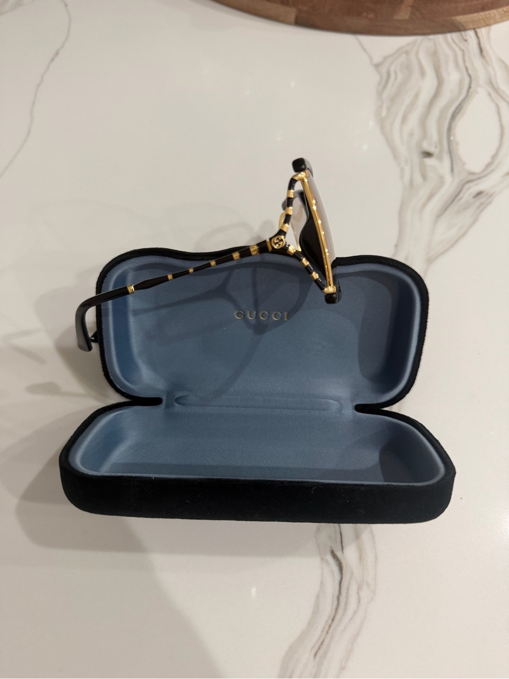 Gucci Black and Gold Women's Sunglasses with Striped Temples
